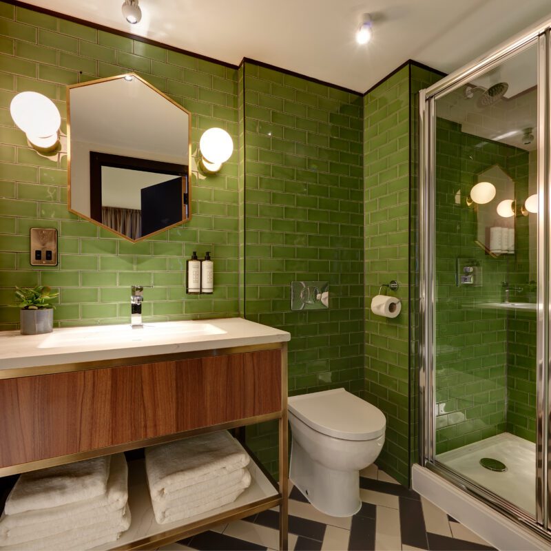 brama studio bathroom with green tiles
